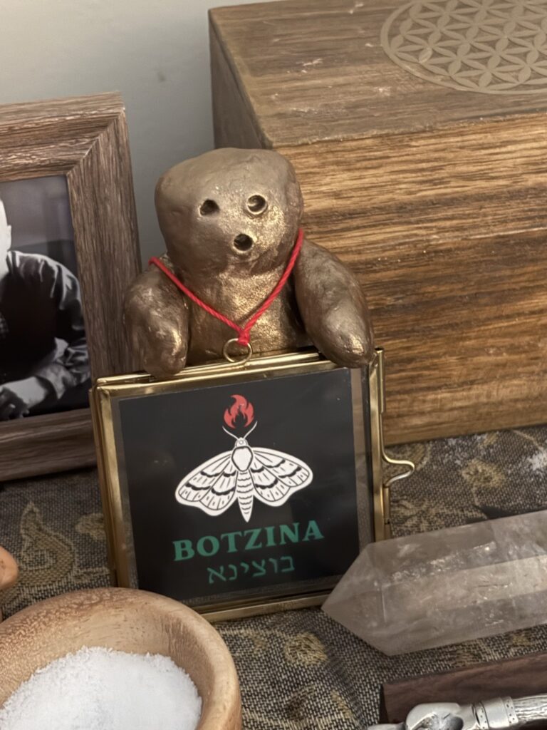 Sholem the golem with the Botzina logo